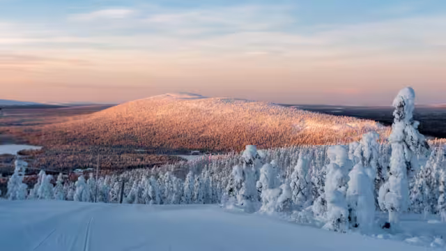 Polar sunrise view of ski slopes and mountains in Levi, Kittilä, Lapland, Finland