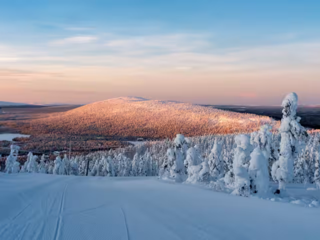 Polar sunrise view of ski slopes and mountains in Levi, Kittilä, Lapland, Finland