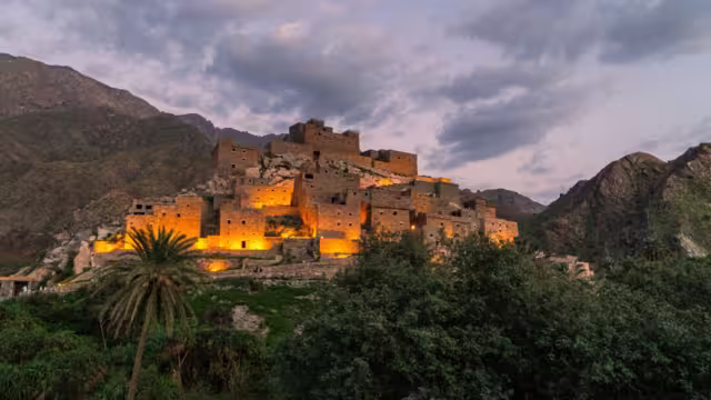 Thee Ain Heritage Village, Saudi Arabia with the lights on at dusk, Saudi Arabia