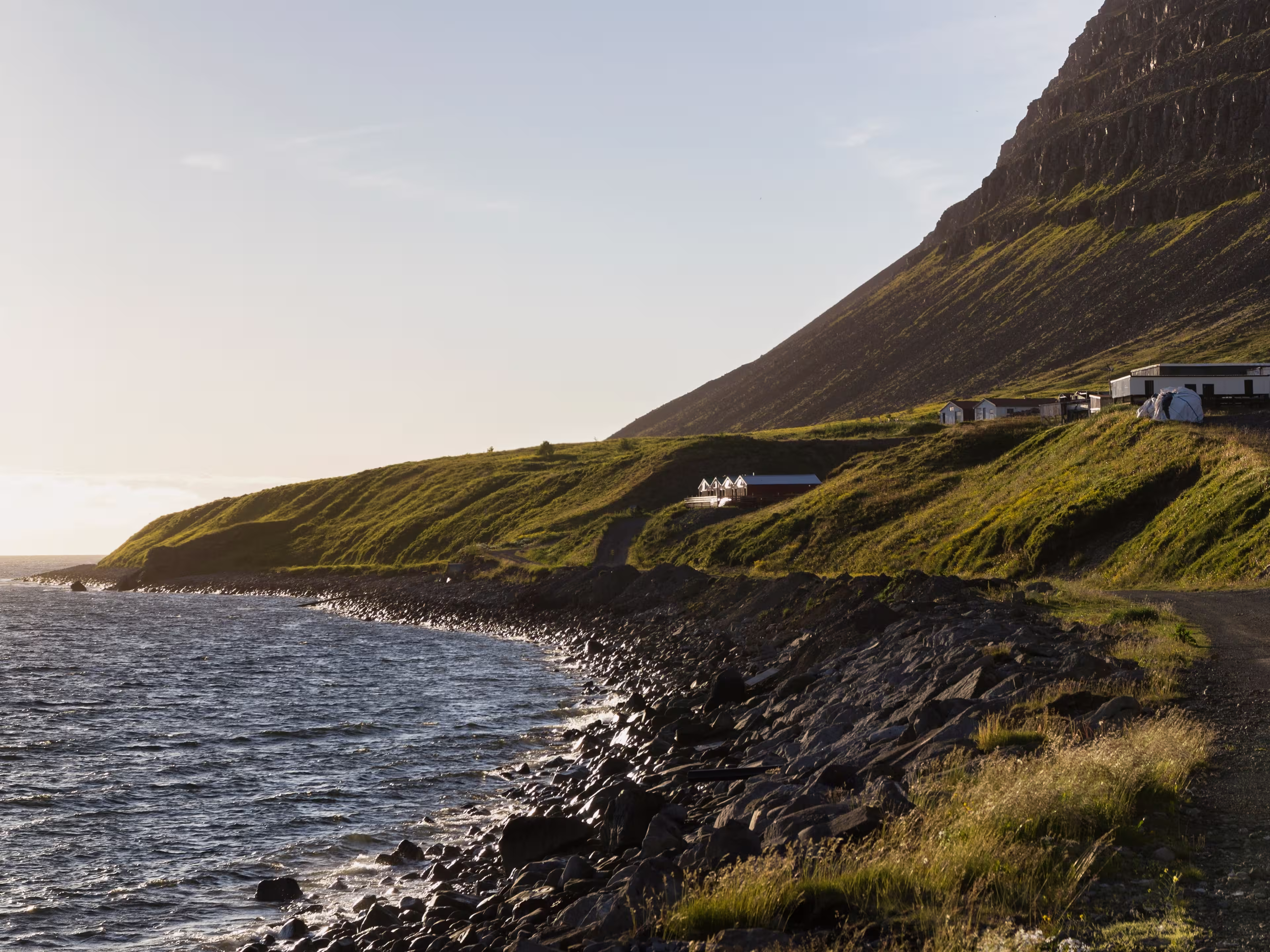 look through the scenic coastline of Patreksfjörður at sunset