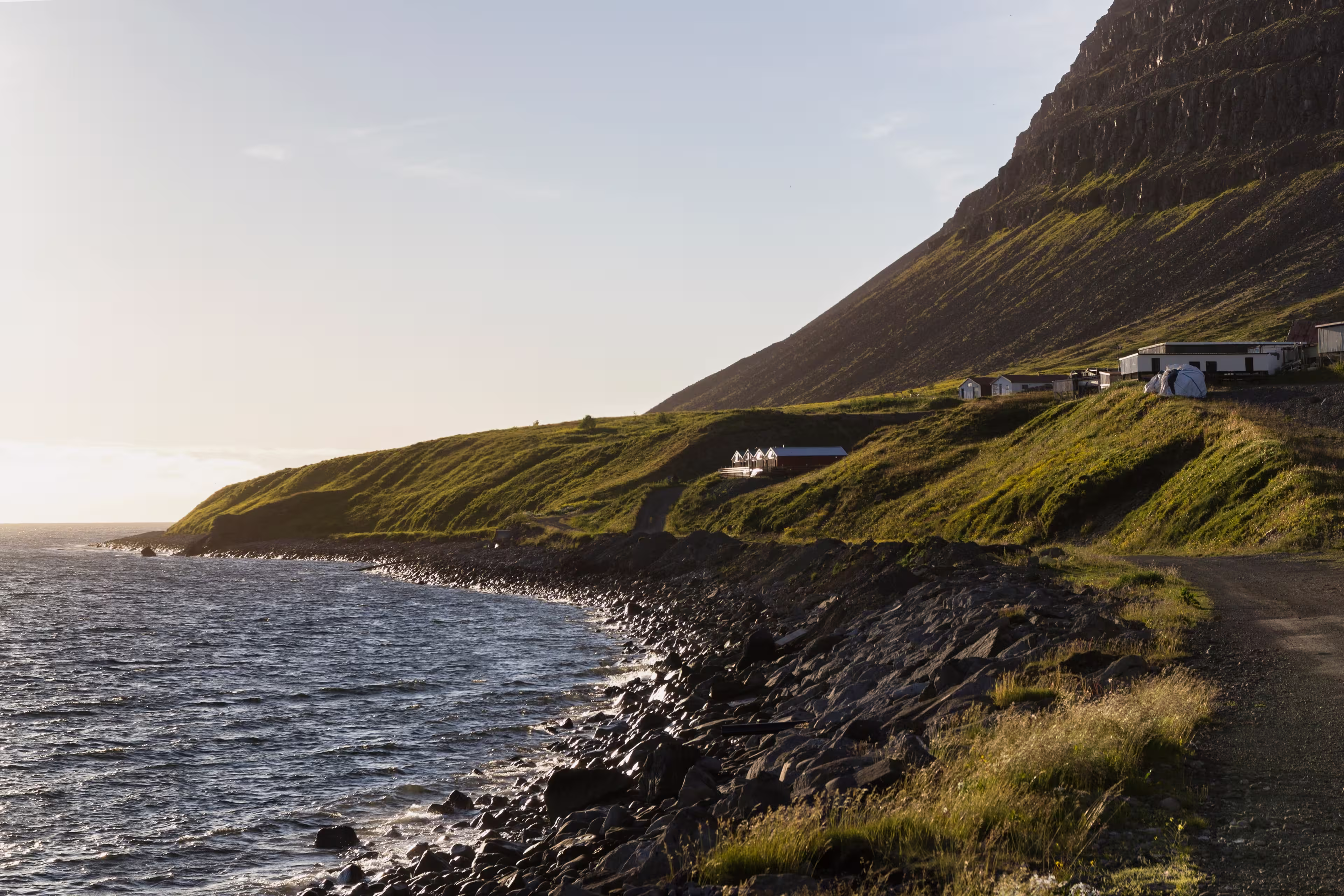 look through the scenic coastline of Patreksfjörður at sunset