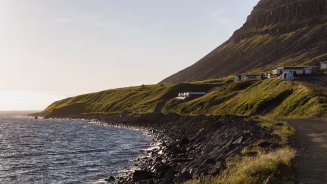 look through the scenic coastline of Patreksfjörður at sunset