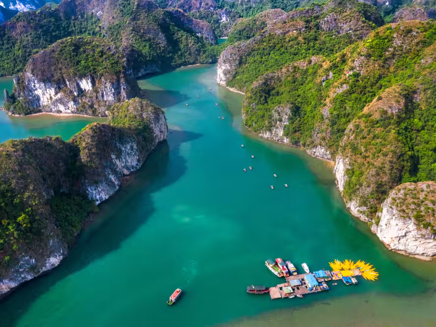 Aerial view of Sang cave and Kayaking area, Halong Bay, Vietnam, Southeast Asia. UNESCO World Heritage Site. Junk boat cruise to Ha Long Bay. Popular landmark, famous destination of Vietnam