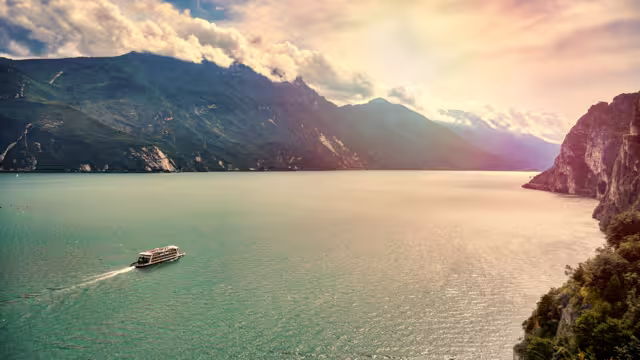 View of the beautiful Lake Garda surrounded by mountains, Riva del Garda town and Garda lake in the autumn time , Trentino Alto Adige region,Italy