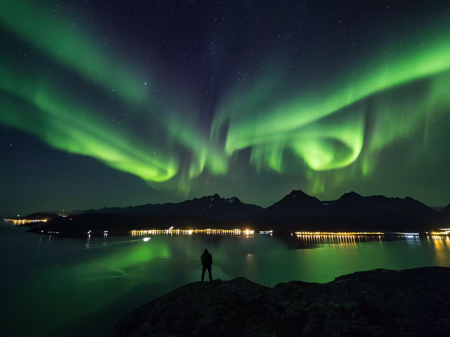 Take in the Northern Lights over the Lyngen Alps and fjord