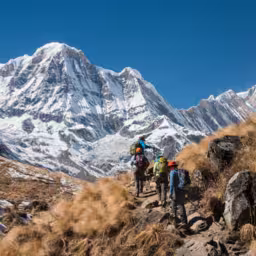 Trekking in Annapurna region, with Annapurna South in background, Nepal