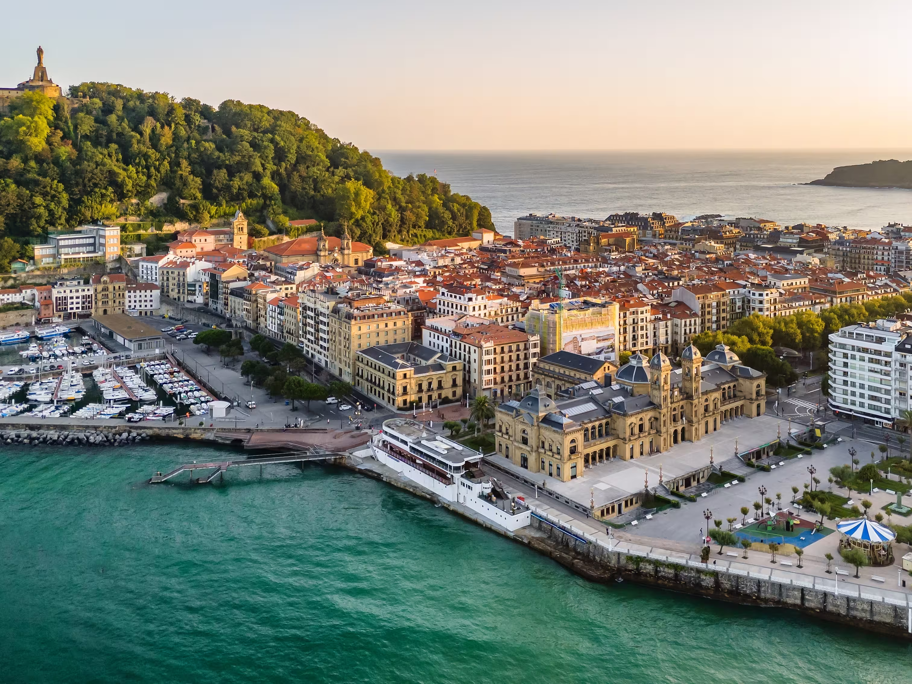 Aerial view of San Sebastian cityscape at sunrise in the Basque Country, northern Spain. Donostia old town in morning sunlights
