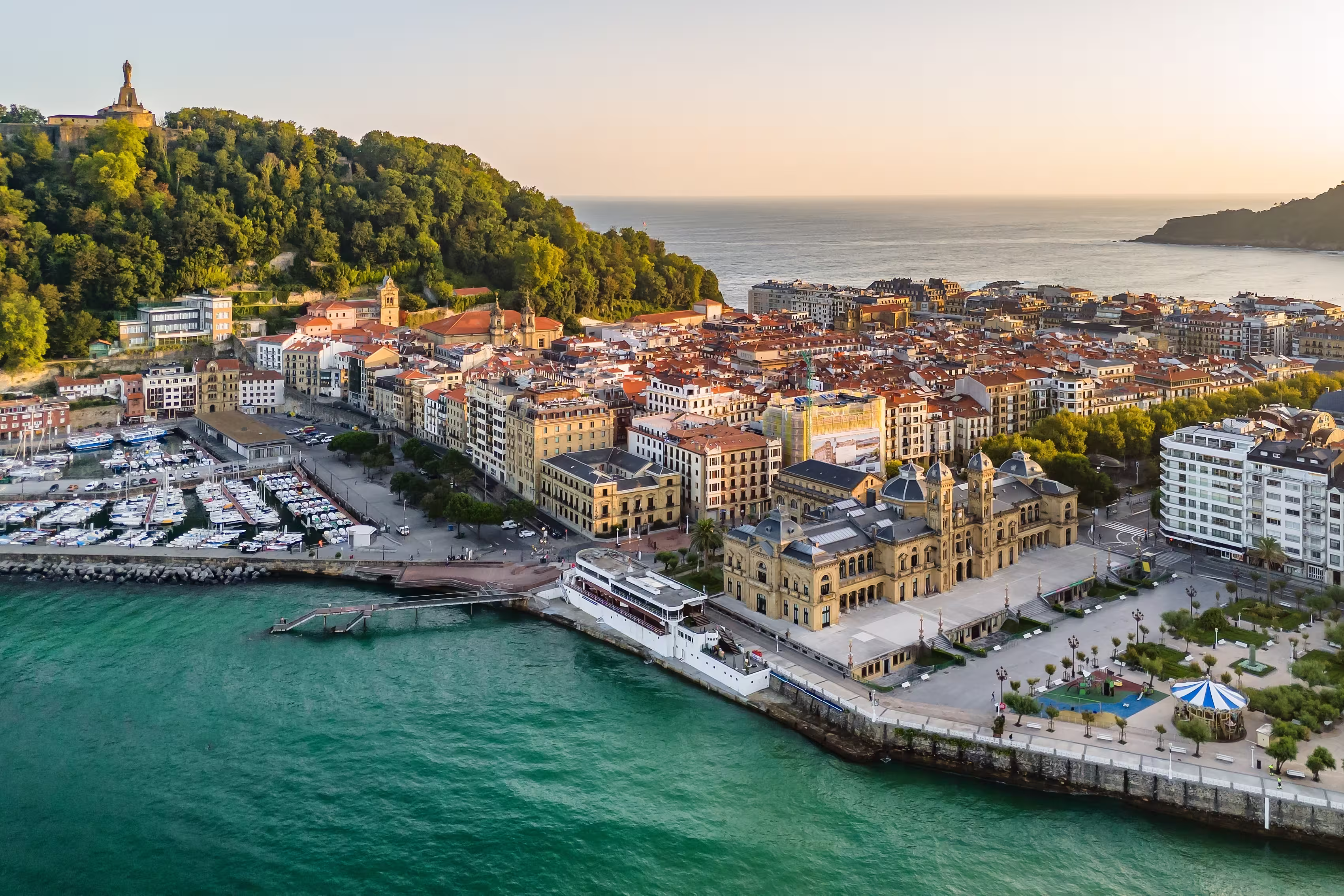 Aerial view of San Sebastian cityscape at sunrise in the Basque Country, northern Spain. Donostia old town in morning sunlights