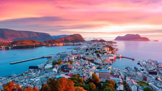 Colorful sunset in Alesund port town on western coast of Norway. Place where the ocean meet the mountains. Landscape photography