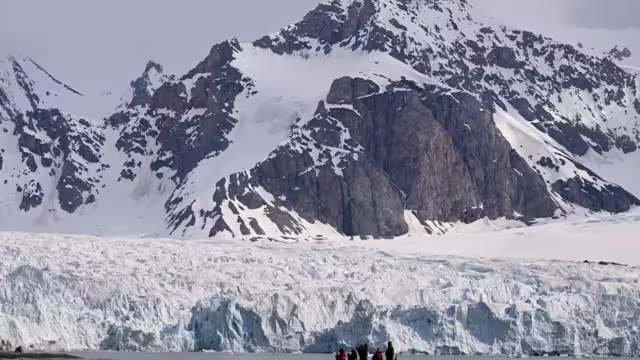 Experience the quiet majesty of glacial fjords and towering mountains in Svalbard