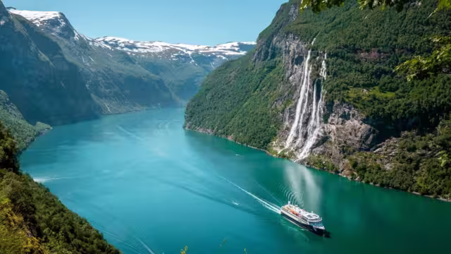 A Norwegian ferry navigates the Geirangerfjord
