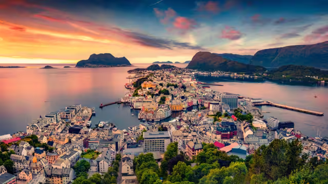 Picturesque summer view from flying drone of Alesund port. Great sunset in west coast of Norway, at the entrance to the Geirangerfjord. Traveling concept background.