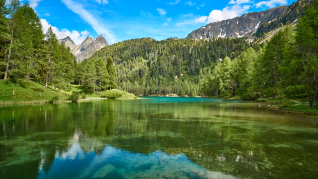 Landscape panorama of Lai da Palpuogna / Palpuognasee, mountain lake, Albula Pass in the municipality of Bergün, in the Grisons, Switzerland