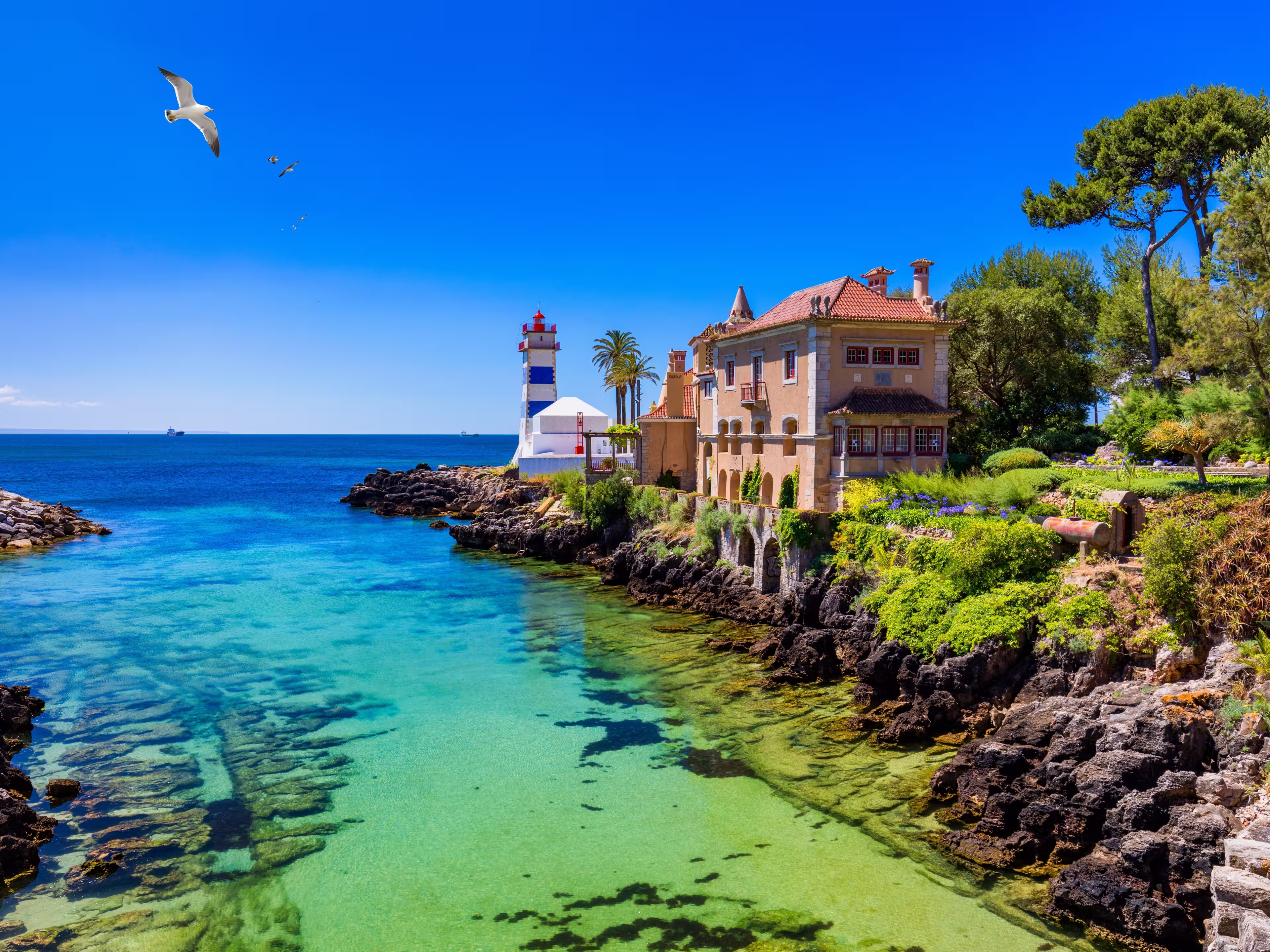 Santa Marta lighthouse and Municipal museum, Cascais, Lisbon, Portugal. Lighthouse Museum of Santa Marta in Cascais Portugal, as seen from Santa Marta Beach on a beautiful day. Cascais, Portugal.