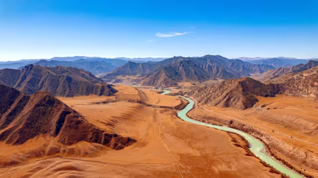 Aerial top view autumn Landscape beautiful green blue river mountains Altai.