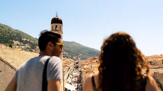Intrepid travellers looking out over the main street of Dubrovnik, Croatia