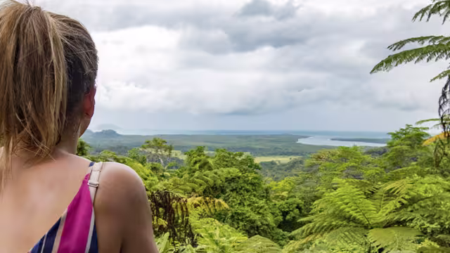 Traveller overlooking Cape Tribulation in Queensland, Australia