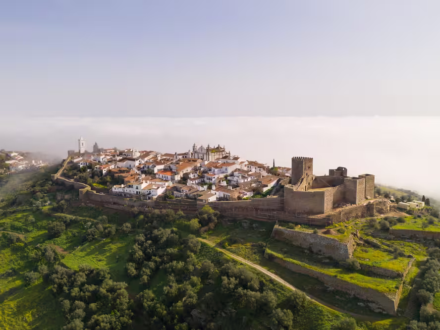 Monsaraz drone aerial view on the clouds in Alentejo, Portugal