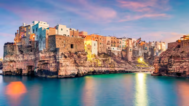 Panoramic evening cityscape of Polignano a Mare town, Puglia region, Italy, Europe.
