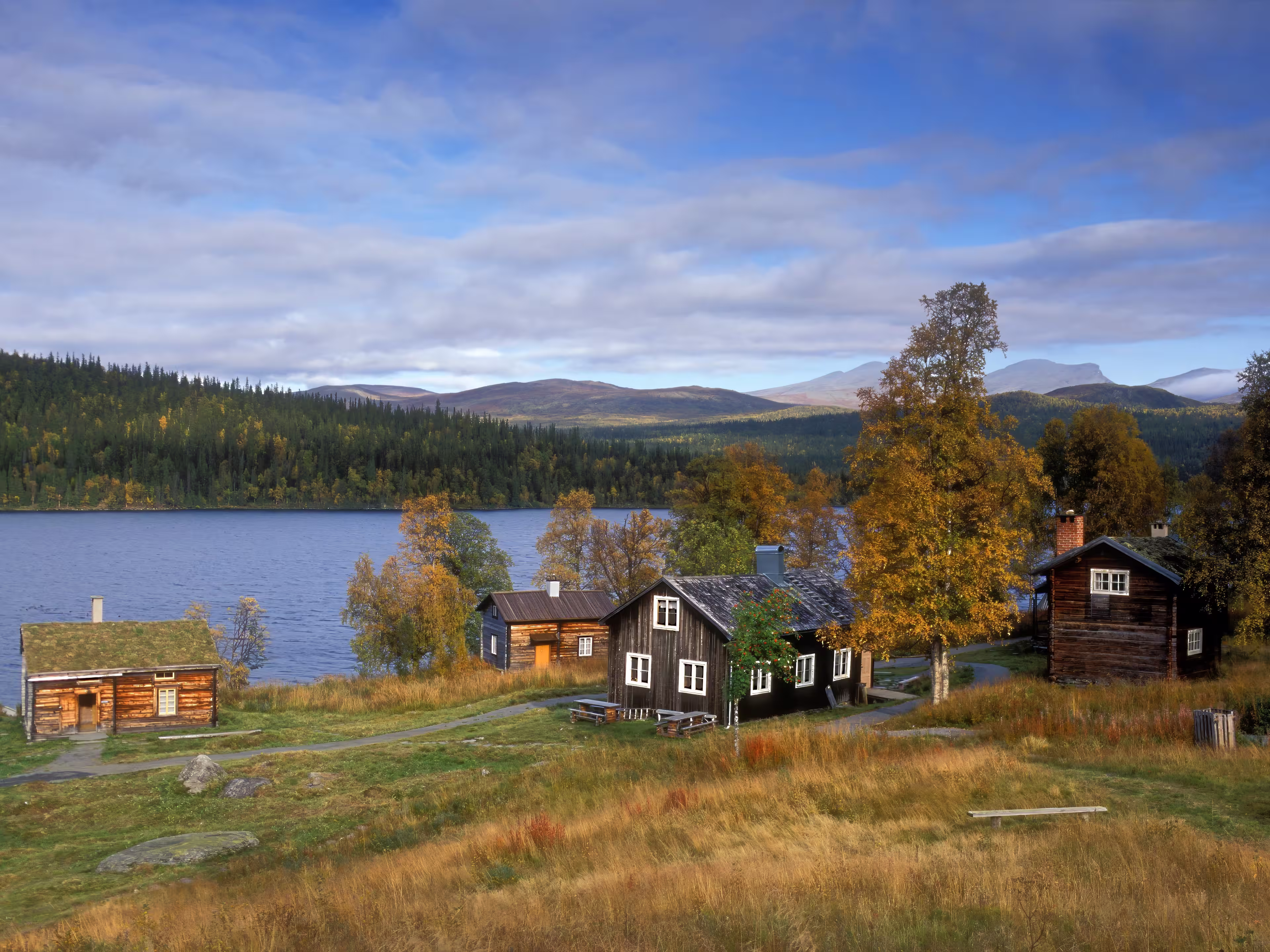 Lapland, Sweden – SEPTEMBER 08, 2006: The old wooden Sápmi Churchtown in Fatmomakke village. Wooden buildings, cabins, warehouse and Sámi hut, goahti.