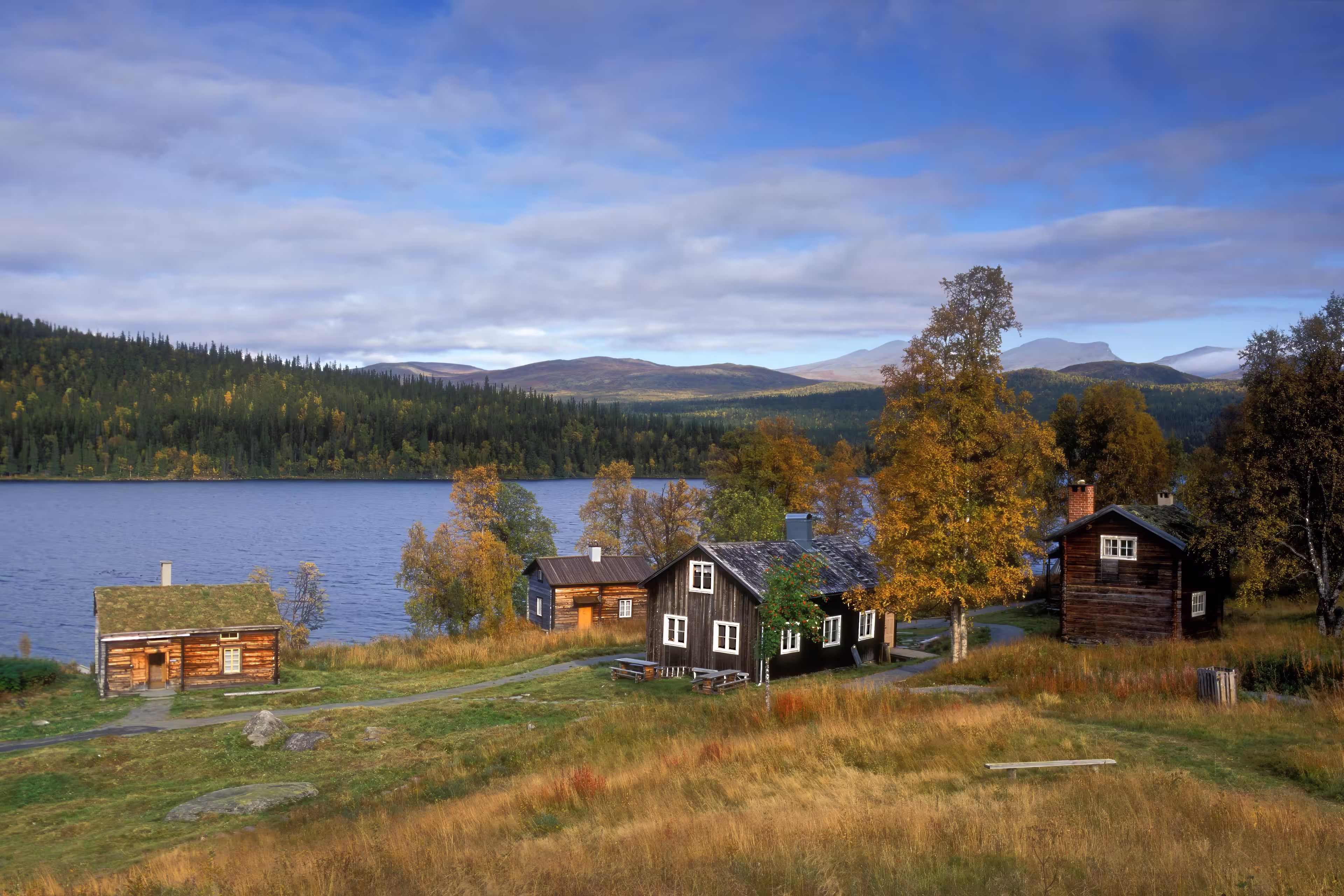 Lapland, Sweden – SEPTEMBER 08, 2006: The old wooden Sápmi Churchtown in Fatmomakke village. Wooden buildings, cabins, warehouse and Sámi hut, goahti.