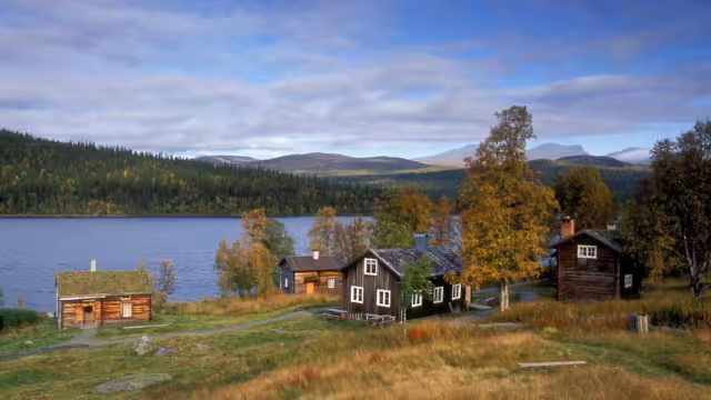 Lapland, Sweden – SEPTEMBER 08, 2006: The old wooden Sápmi Churchtown in Fatmomakke village. Wooden buildings, cabins, warehouse and Sámi hut, goahti.