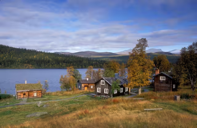 Lapland, Sweden – SEPTEMBER 08, 2006: The old wooden Sápmi Churchtown in Fatmomakke village. Wooden buildings, cabins, warehouse and Sámi hut, goahti.
