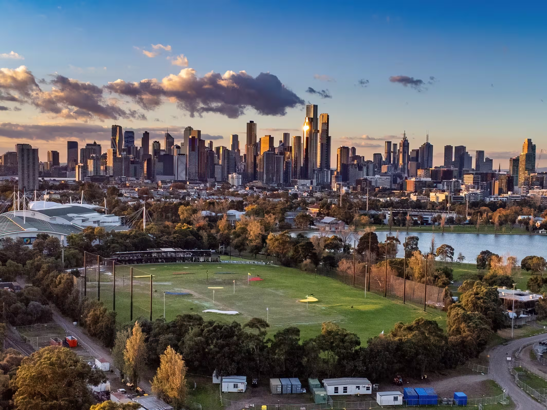Melbourne, Victoria, Australia - Aerial view of Albert Park lake, golf driving range and Melbourne city skyline at sunset.
