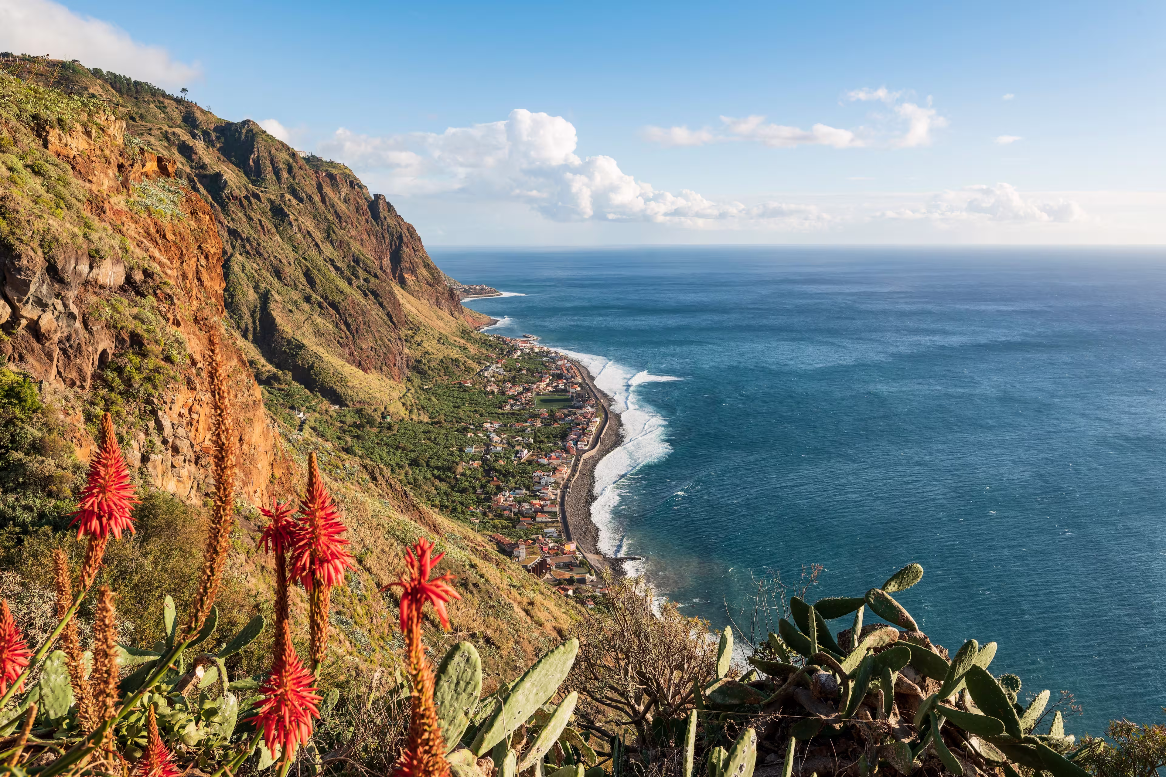 Panoramic view of Paul do Mar and the coast of Madeira near Fãja da Ovelha, seen from the "Miradouro do Massapez" viewpoint