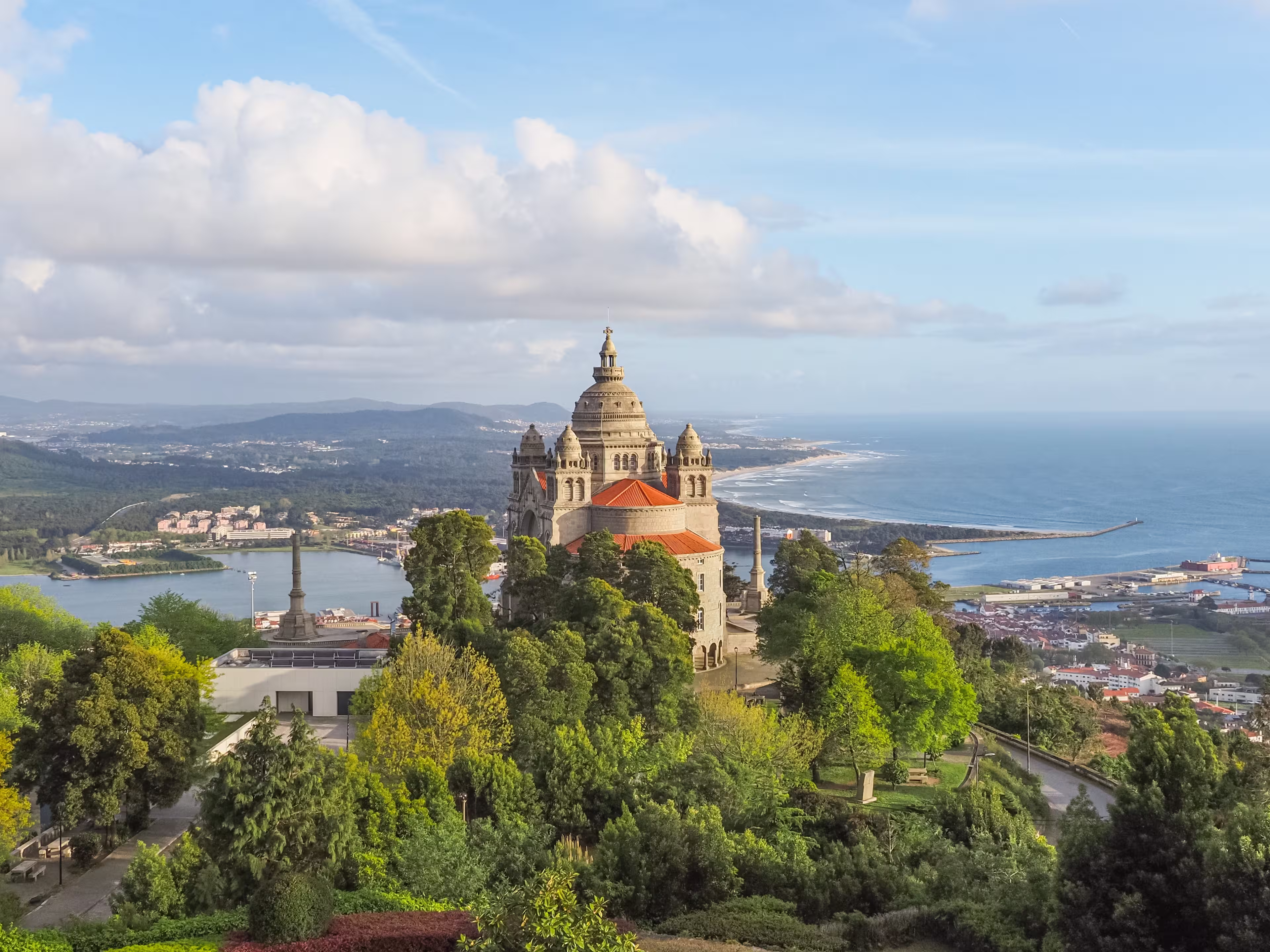 Viana do Castelo, small city on the coast of Atlantic ocean, Portugal. In the landscape dominates Catholic shrine Santa Lucia Church or Sanctuary of the Sacred Heart of Jesus, against blue cloudy sky.