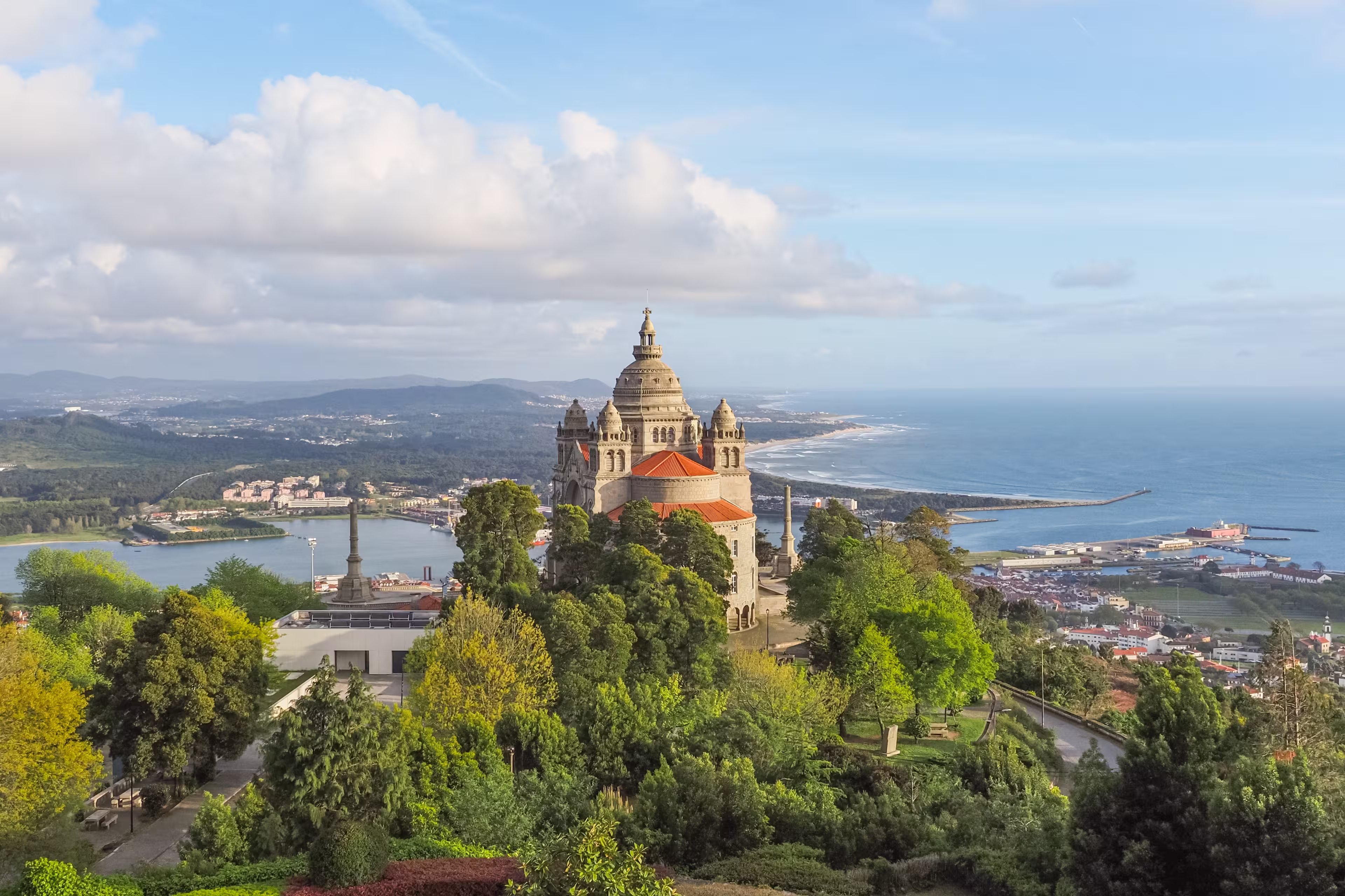 Viana do Castelo, small city on the coast of Atlantic ocean, Portugal. In the landscape dominates Catholic shrine Santa Lucia Church or Sanctuary of the Sacred Heart of Jesus, against blue cloudy sky.