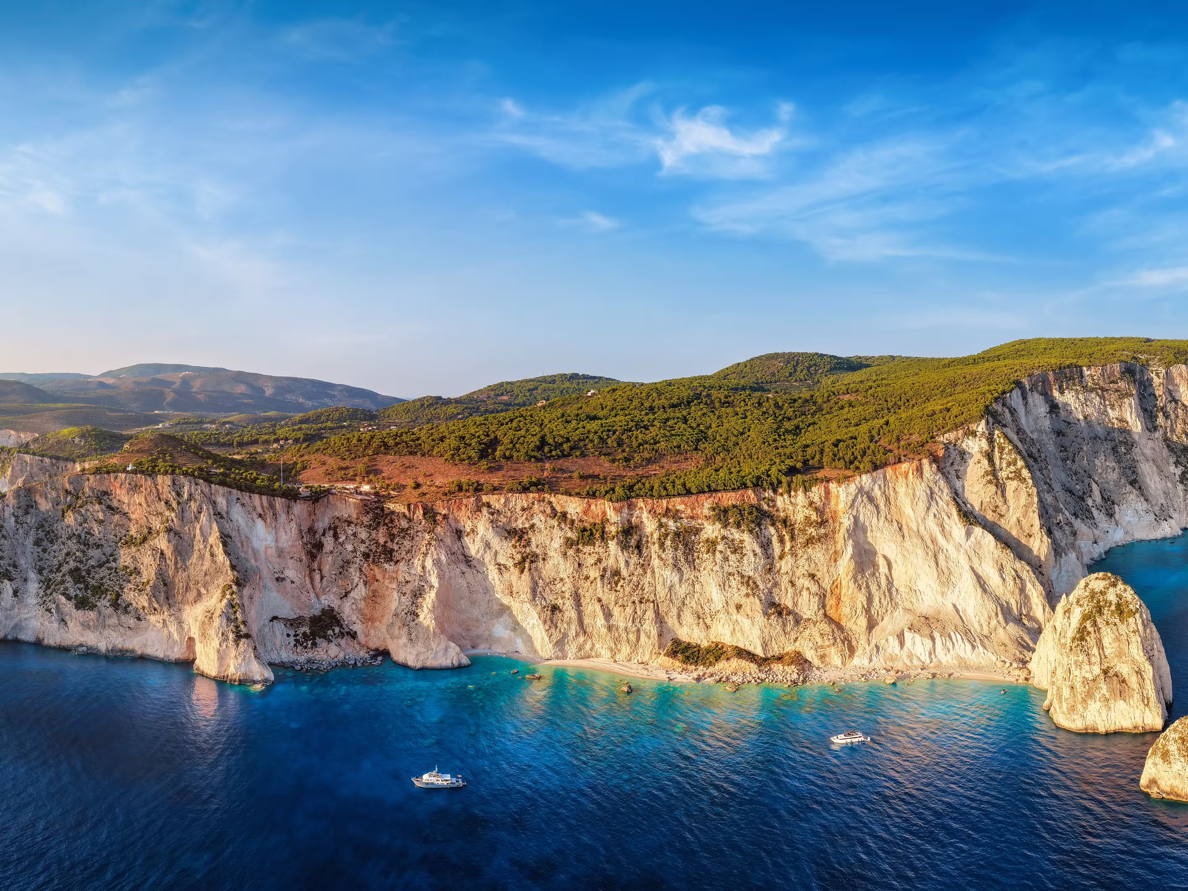 Aerial sunset view of the south coast of Zakynthos island, Greece, with the famous beaches and caves at the Keri area, viewpoint and lighthouse