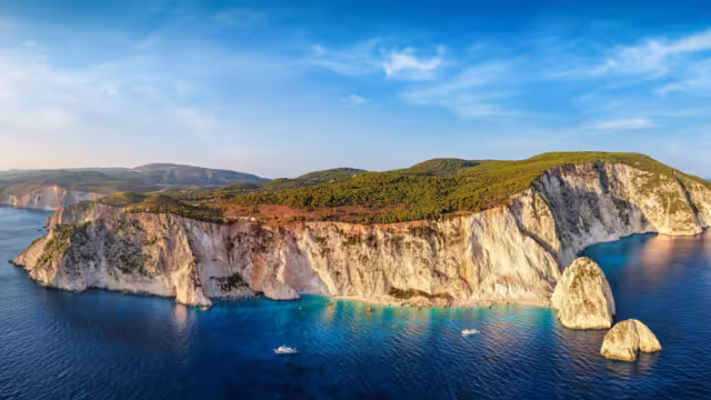 Aerial sunset view of the south coast of Zakynthos island, Greece, with the famous beaches and caves at the Keri area, viewpoint and lighthouse