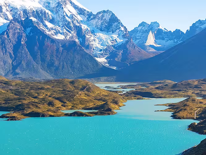 Hiker standing in front of the mountains in Torres del Paine NP, Chile