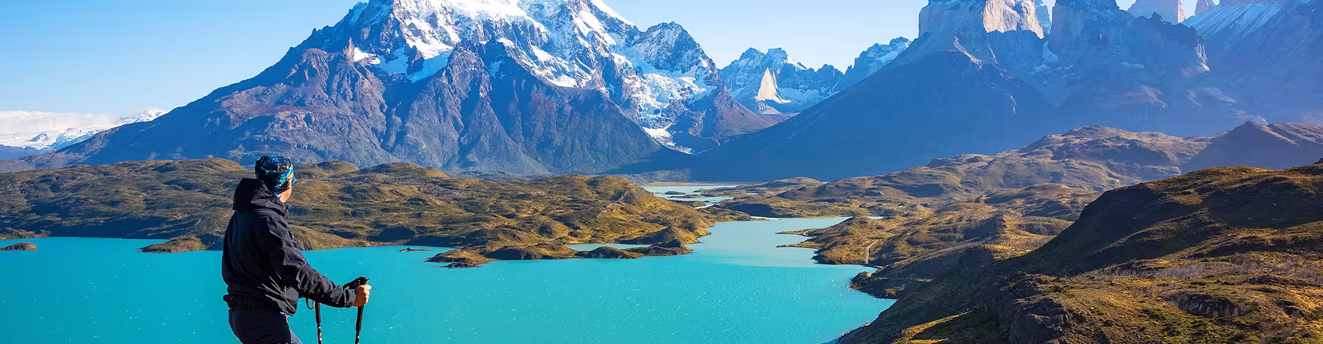 Hiker standing in front of the mountains in Torres del Paine NP, Chile