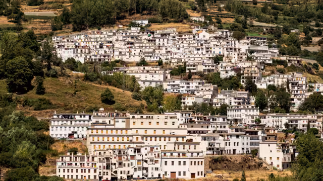 Scenic view of Trevélez village and its white terraced houses, seen from the other side of the Río Trevélez valley, Las Alpujarras, Sierra Nevada National Park, Andalusia, Spain