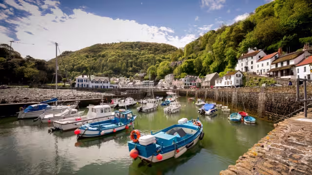The picturesque village of Lynmouth in Devon and its harbour at high tide.