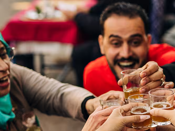 Group enjoying mint tea Marrakesh, Morocco