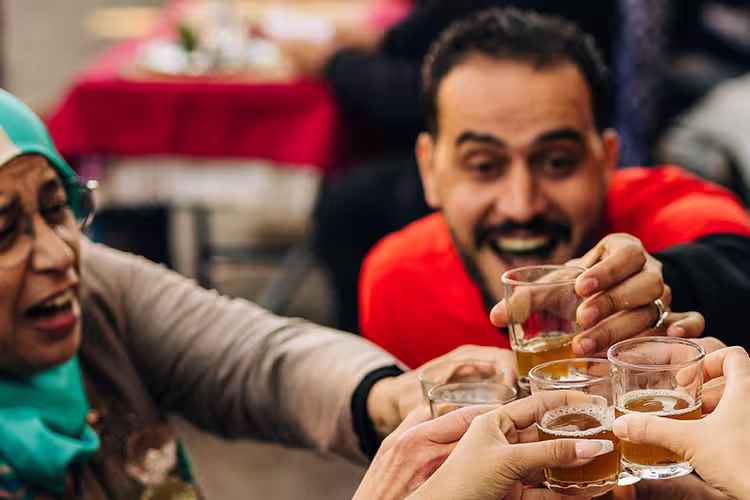 Group enjoying mint tea Marrakesh, Morocco