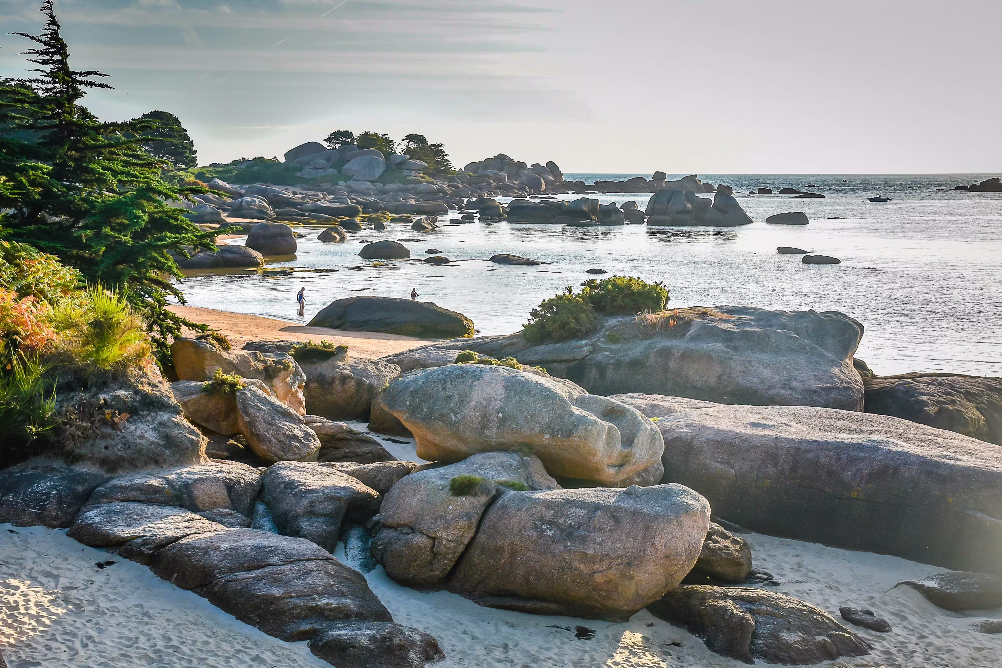 Dawn light at Ty-Lia Beach on the Ile Renote facing Saint Anne Bay (Biae de Sanite Anne) near the coastal village of Tregastel on the Red Granite Coast of northern Brittany, France.