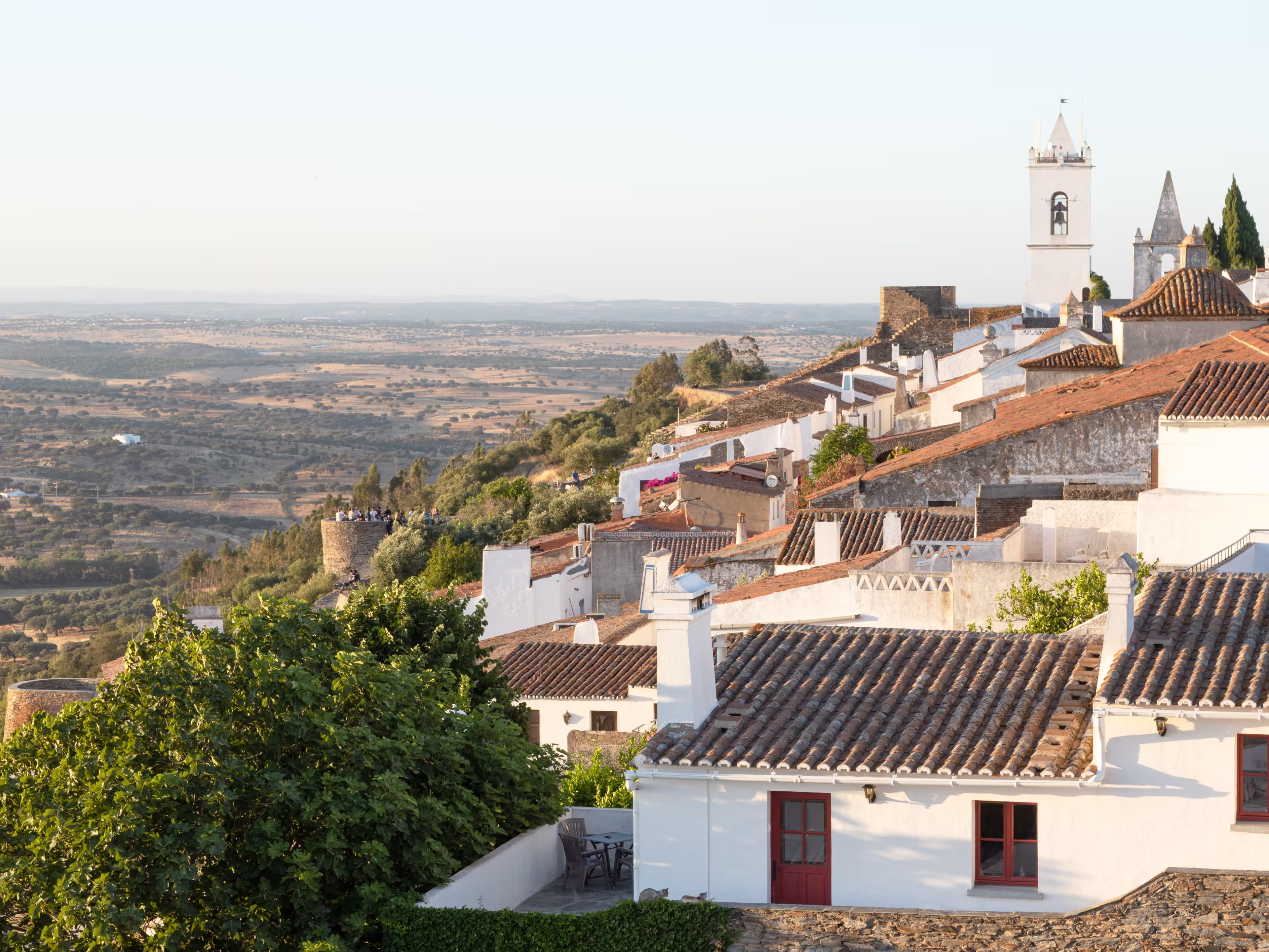 graceful medieval village of Monsaraz view from the highest part of the castle. Historic village made of lime and schist, located on the top of the hill. Alentejo destination. picturesque white facade