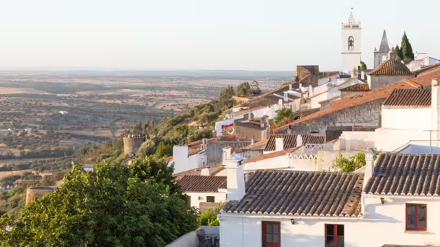 graceful medieval village of Monsaraz view from the highest part of the castle. Historic village made of lime and schist, located on the top of the hill. Alentejo destination. picturesque white facade