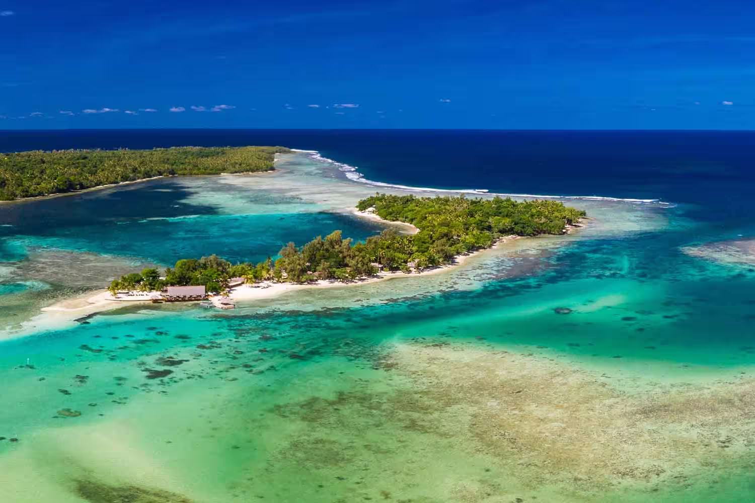 A wide aerial shot of a coastline in Vanuatu