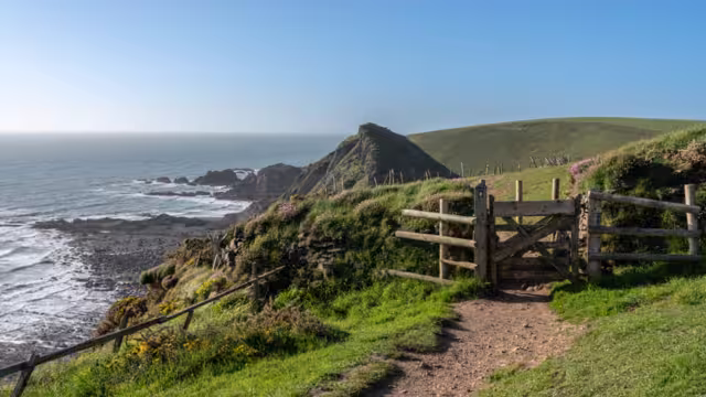 Gate over headlands on south west coastal path near Hartland Quay in North Devon, England