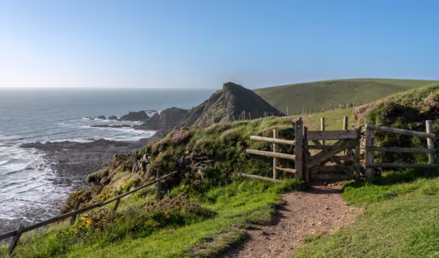 Gate over headlands on south west coastal path near Hartland Quay in North Devon, England