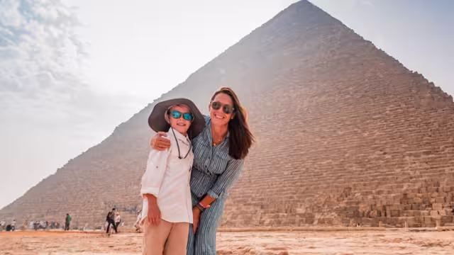 At the base of the Great Pyramids of Giza outside Cairo