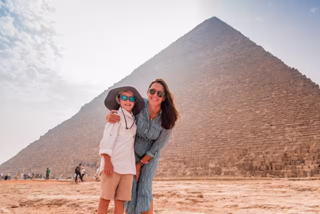 At the base of the Great Pyramids of Giza outside Cairo