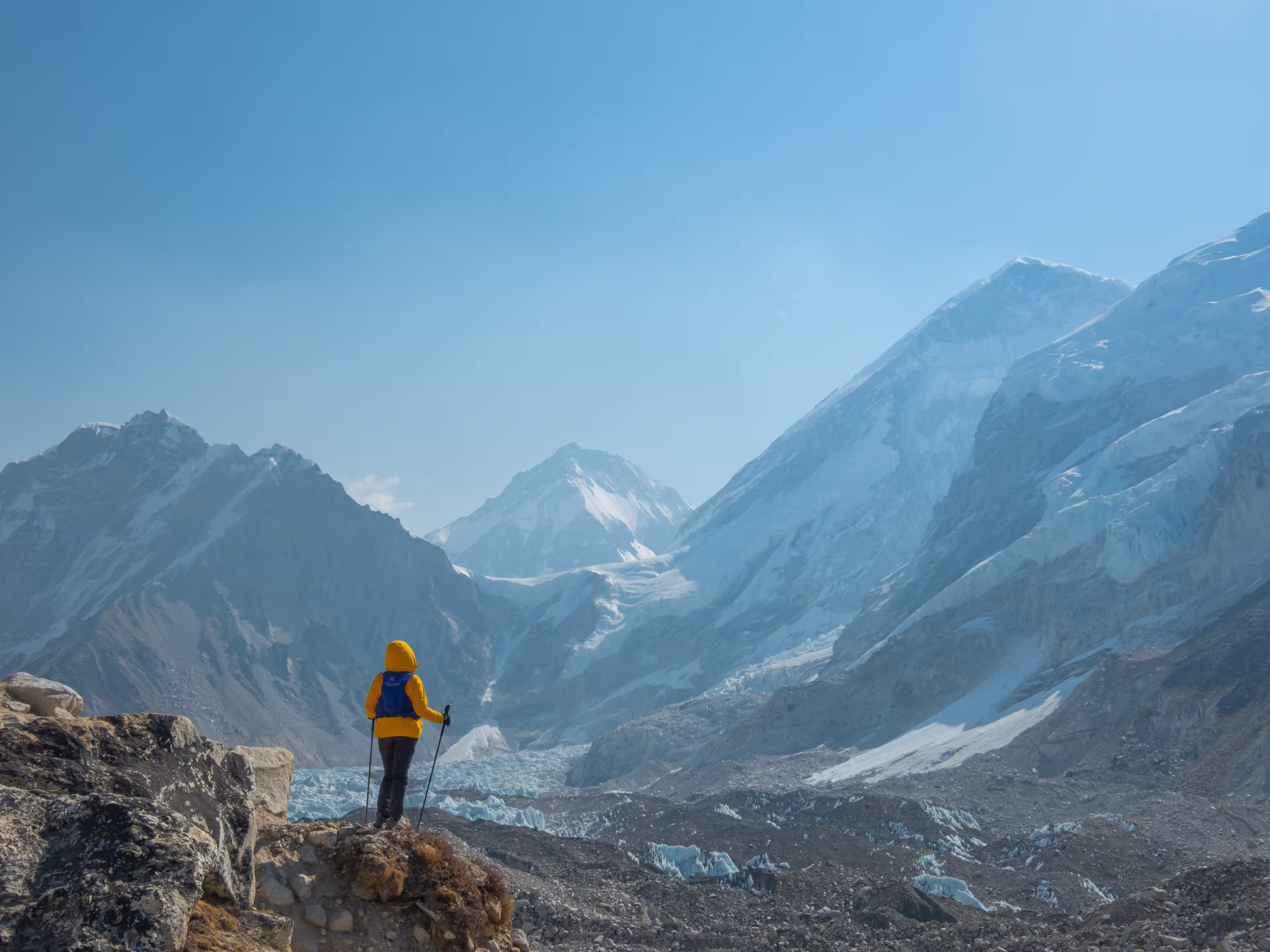 Male backpacker enjoying the view on mountain walk in Himalayas. Everest Base Camp trail route, Nepal trekking, Himalaya tourism. Travel, adventure, sport concept