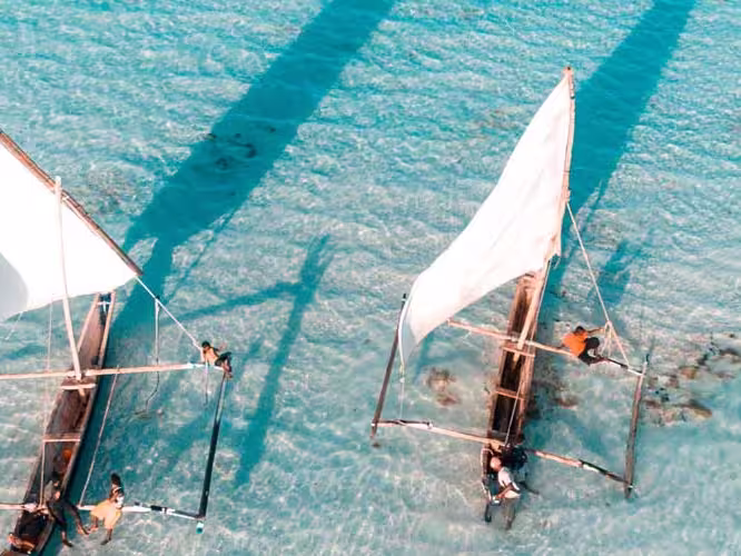 Aerial view of fisherman on the clear waters of Zanzibar