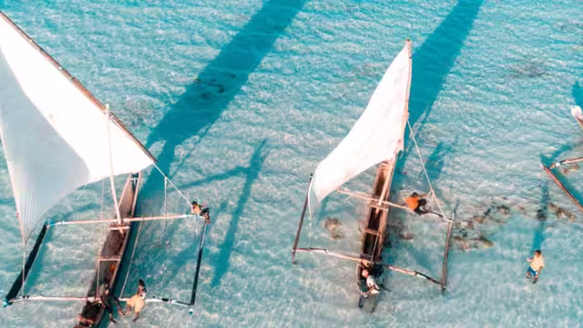 Aerial view of fisherman on the clear waters of Zanzibar